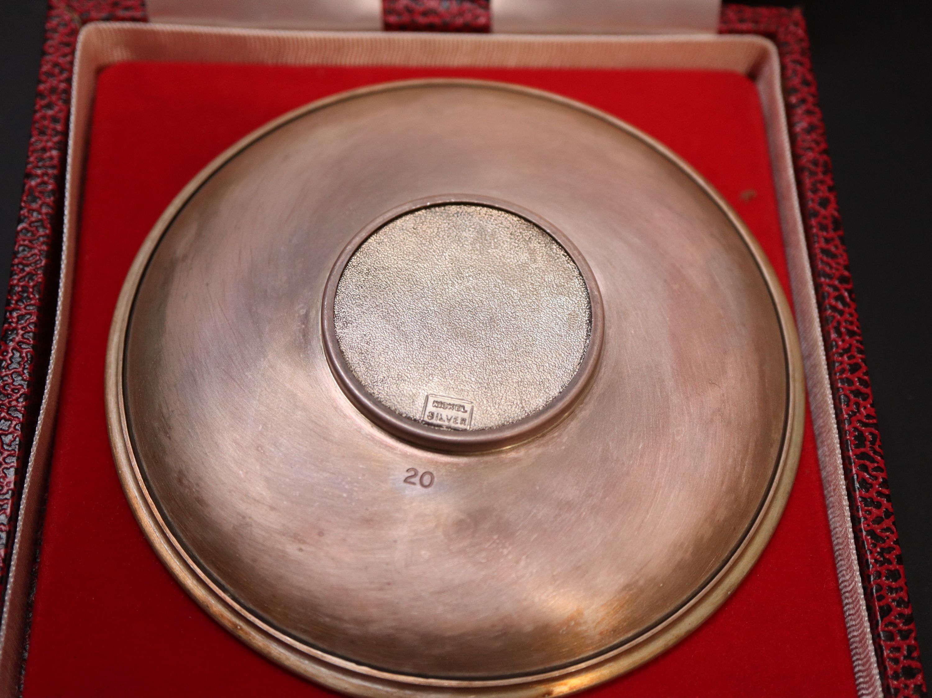 A Queen Elizabeth Silver Jubilee Coldstream Guards commemorative silver armada dish, diameter 10.15cm, cased, gross 79 grams.